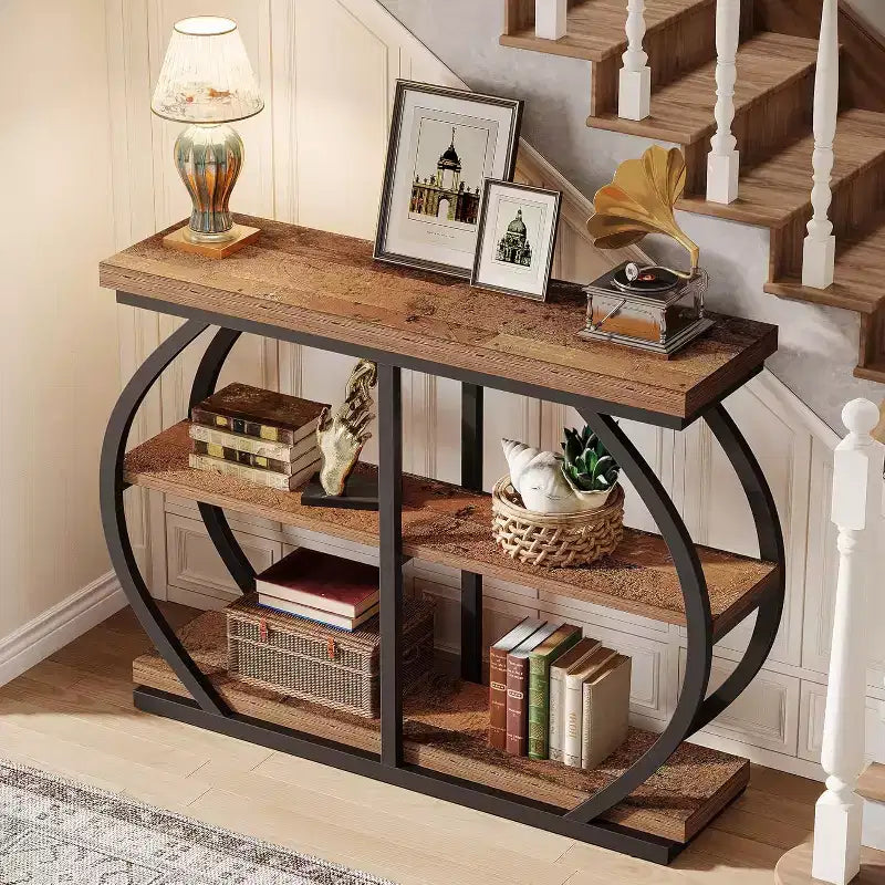 Console industrielle de 41.3 avec 3 niveaux, structure métallique arquée et étagères de rangement, marron mélangé, adaptée au salon et au couloir.